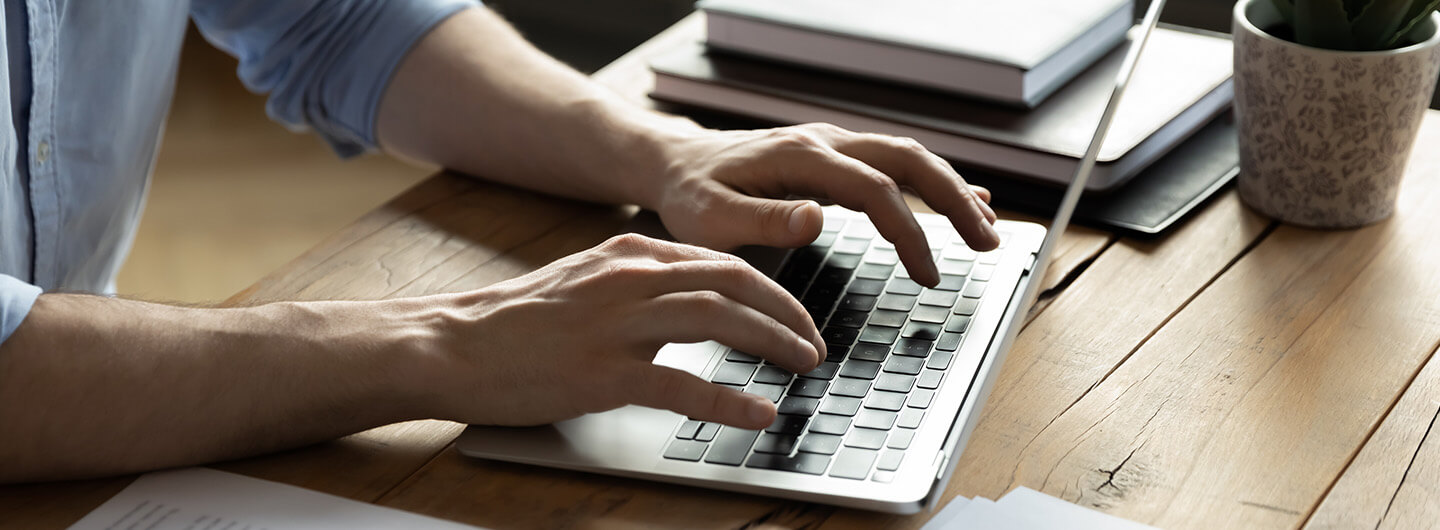 Person typing on a laptop